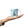 Personalized Alaa Arabic calligraphy blue watercolor mug held.