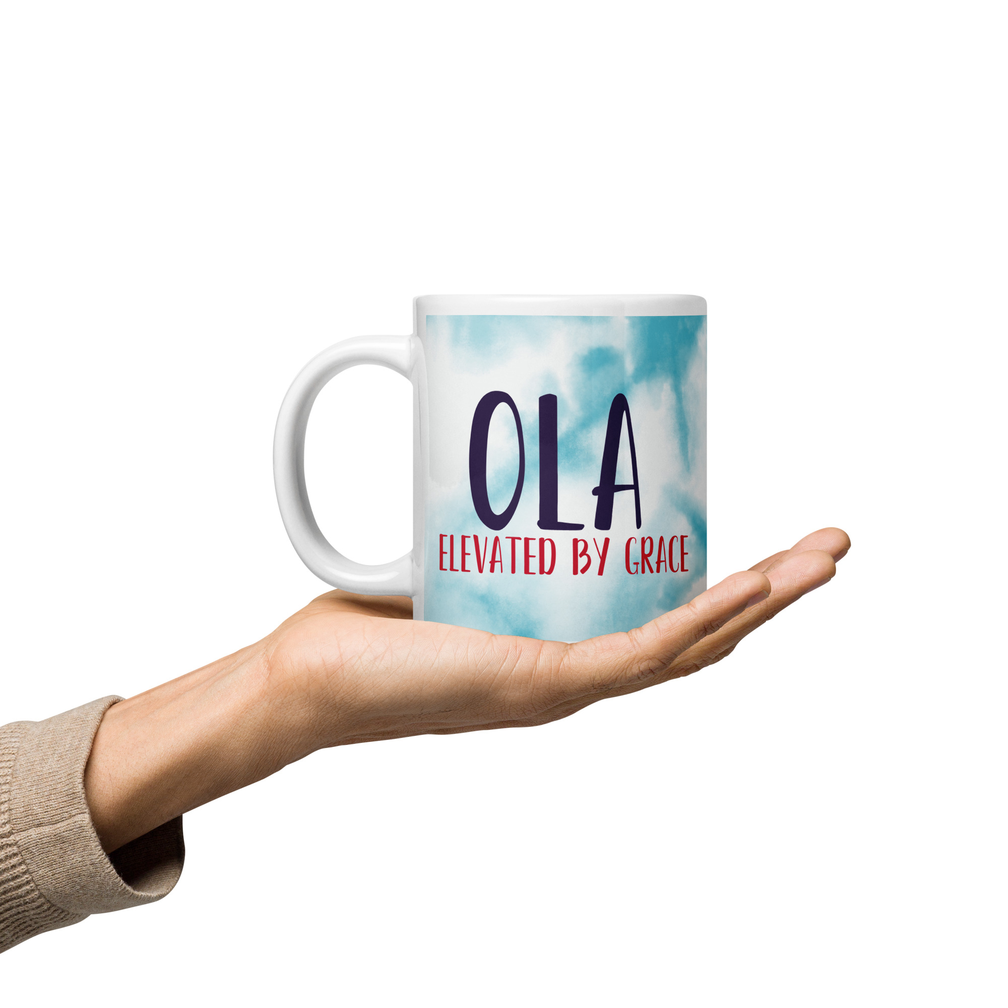 Custom OLA Elevated by Grace tie-dye mug held.