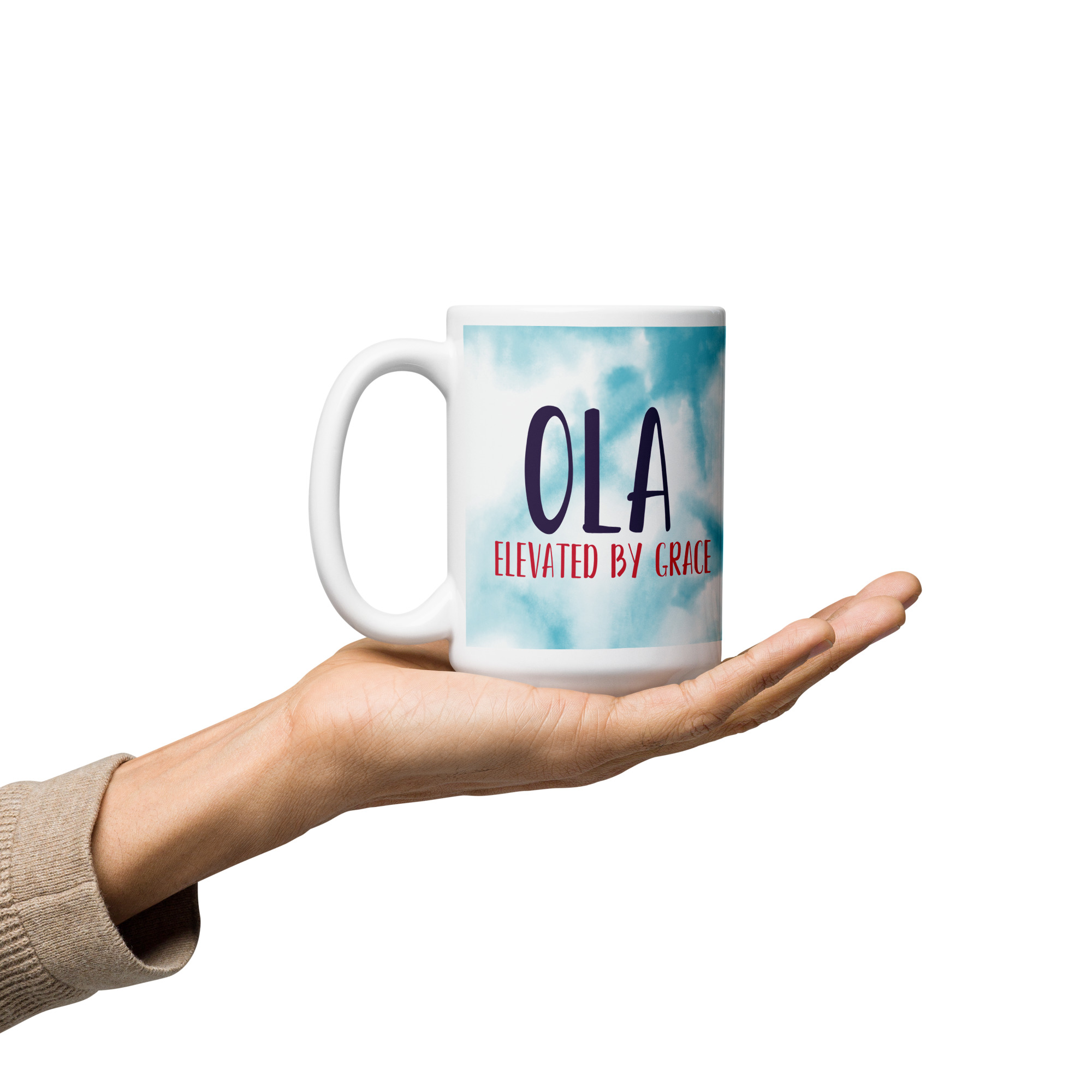 White mug: OLA ELEVATED BY GRACE watercolor design held.