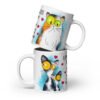White ceramic mug with two colorful cats and “Life is short hug your meow” text