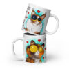 White ceramic mug with two cats, turquoise background, hearts, and the quote “Life is short hug your meow.