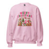 Pink Christmas sweatshirt with gingerbread, snowman, and festive drinks graphic.