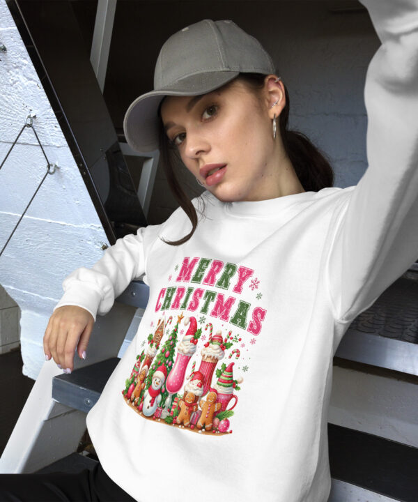 Young woman models Merry Christmas sweatshirt taking a selfie.