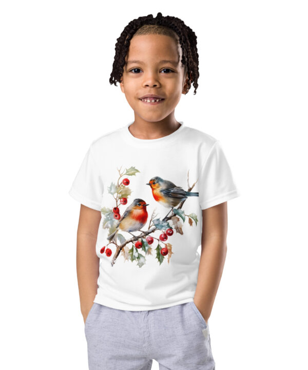 Smiling girl wearing a kids t-shirt with red robins and holly branch design β festive winter outfit by Printivoo