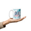 White mug: OLA ELEVATED BY GRACE watercolor design held.