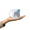 Ola Elevated by Grace blue tie-dye mug held.