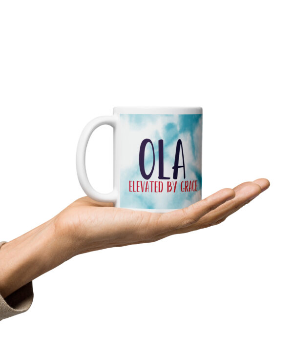 Ola Elevated by Grace blue tie-dye mug held.
