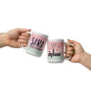 Two custom pastel mugs with Sara designs clinked against a white background