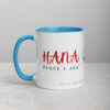 Red Hana ceramic coffee mug with blue interior and handle.