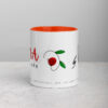 Inspirational MANA JOY coffee mug with orange interior.