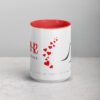 Noor red and white ceramic mug with inspirational heart design.