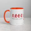 Noor Radiant Light ceramic coffee mug with orange interior and handle.