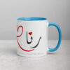 White ceramic Rana mug with blue interior and Arabic calligraphy.