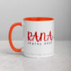 Rana white coffee mug with red text and orange handle.