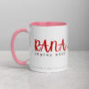 White ceramic Rana Joyful Gaze mug with pink accents.