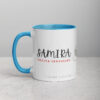Custom Samira coffee mug with blue interior, resting on gray.