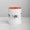 Orange interior coffee mug with heart graphics and text.