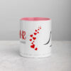 White ceramic Twilight mug with red hearts and inspirational text.