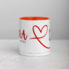 White coffee mug with orange interior and NA♥L red script.