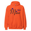 Vibrant orange Shes Mine hoodie with blue heart graphic.